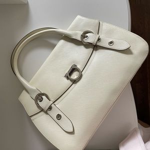 Off white bag/ pink inside. Like new leather.